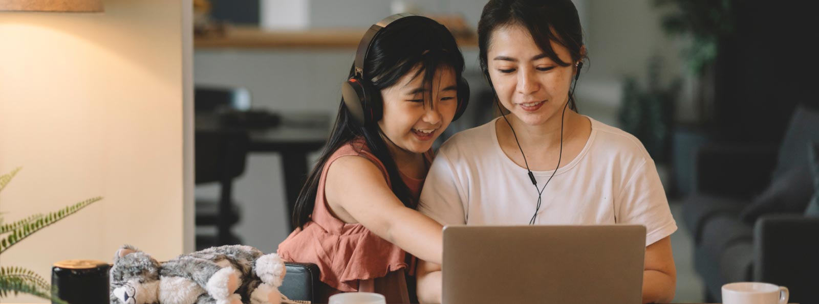 parent and child looking at computer