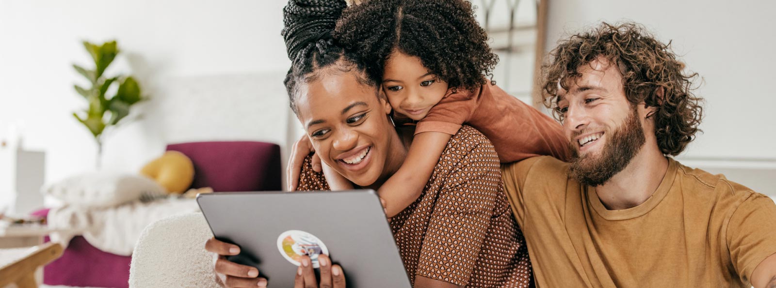 family looking at tablet